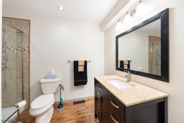 3 Larsen Rd, Franklin Twp, NJ 08873 - full bath with wood finished floors, a tile shower, toilet, vanity, and recessed lighting