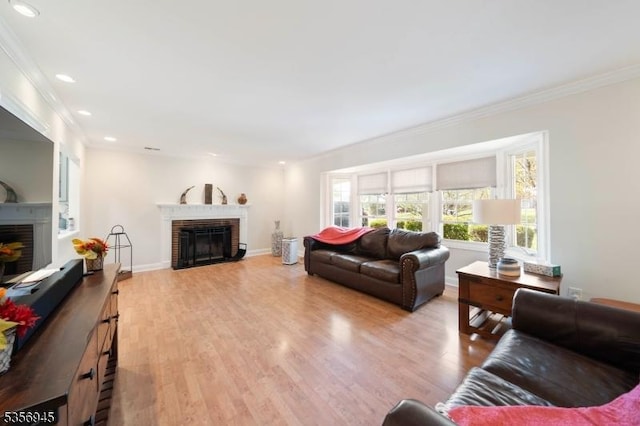 3 Larsen Rd, Franklin Twp, NJ 08873 - living room featuring a brick fireplace, ornamental molding, light wood-style flooring, recessed lighting, and baseboards