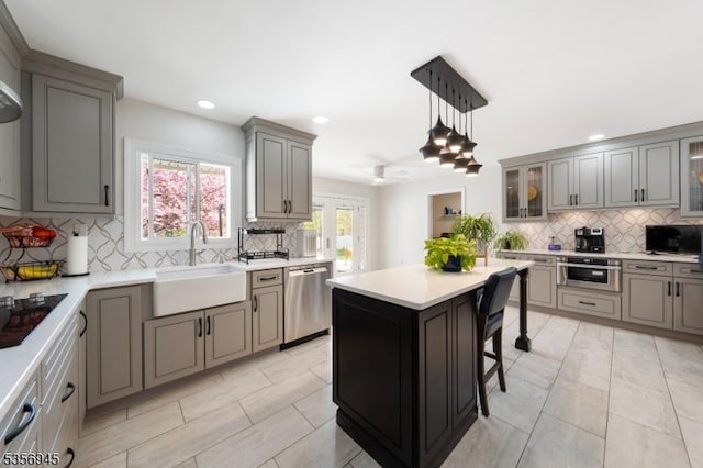 3 Larsen Rd, Franklin Twp, NJ 08873 - kitchen featuring stainless steel appliances, a sink, gray cabinetry, backsplash, and recessed lighting