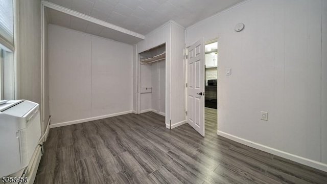 29 Oldham Rd, Wayne Twp, NJ 07470 - unfurnished bedroom with dark wood-type flooring, ornamental molding, a closet, and baseboards