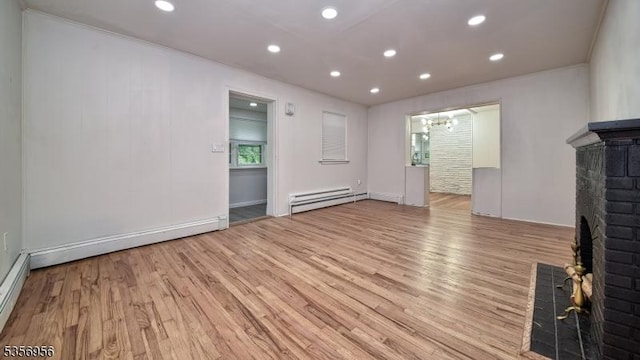 29 Oldham Rd, Wayne Twp, NJ 07470 - unfurnished living room with a baseboard radiator, a brick fireplace, light wood-type flooring, recessed lighting, and a chandelier