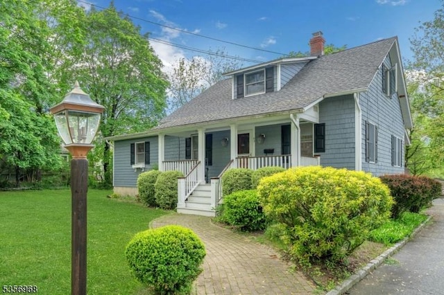 42 Mountain Ave, Mendham Boro, NJ 07945 - bungalow with a porch, a chimney, a front lawn, and roof with shingles