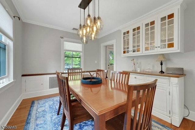 42 Mountain Ave, Mendham Boro, NJ 07945 - dining area featuring light wood-style flooring, crown molding, and a chandelier