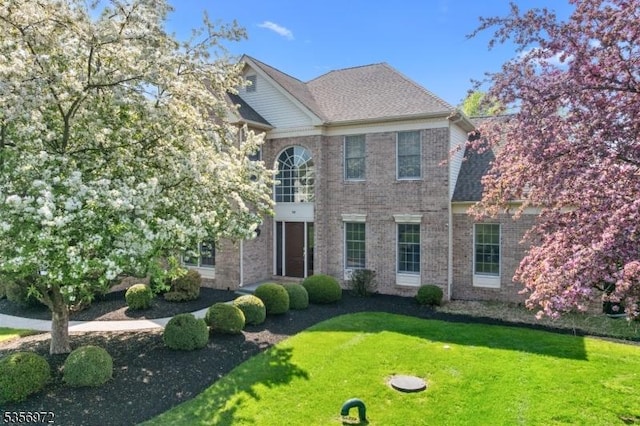 38 Southfield Dr, Montgomery Twp, NJ 08502 - colonial inspired home featuring a front lawn and brick siding