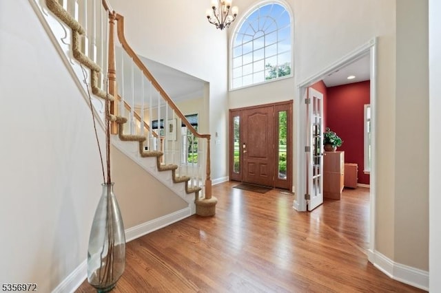 38 Southfield Dr, Montgomery Twp, NJ 08502 - foyer with a towering ceiling, baseboards, wood finished floors, a chandelier, and stairway