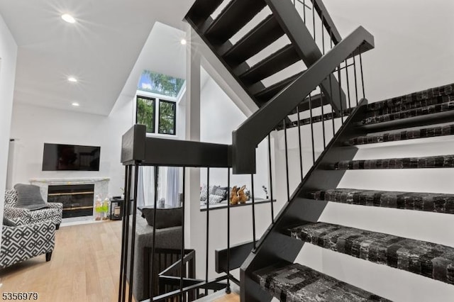 21 Stepping Rdg, North Caldwell Boro, NJ 07006 - stairway featuring wood finished floors, recessed lighting, and a glass covered fireplace