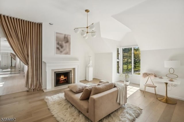 11 Kerby Ln, Mendham Boro, NJ 07945 - living room featuring light wood-style flooring, vaulted ceiling, a fireplace with flush hearth, and baseboards