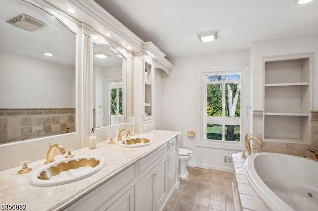 11 Kerby Ln, Mendham Boro, NJ 07945 - bathroom with a garden tub, double vanity, toilet, ornate columns, and baseboards