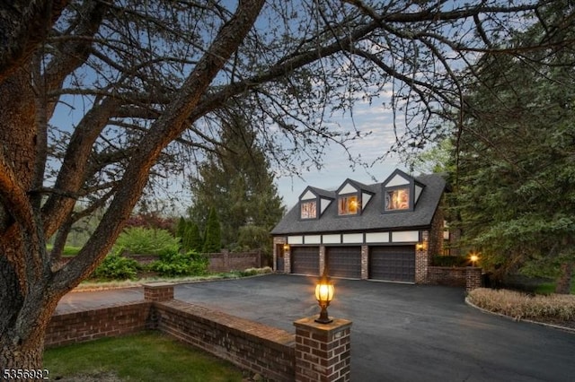 11 Kerby Ln, Mendham Boro, NJ 07945 - view of front of house with an outdoor structure, a shingled roof, and brick siding
