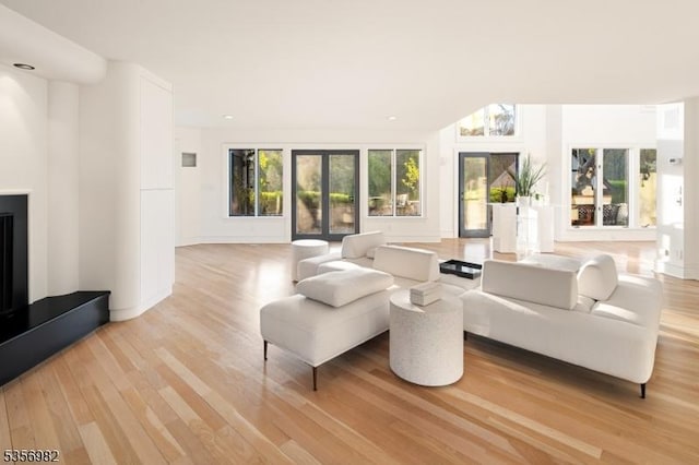 11 Kerby Ln, Mendham Boro, NJ 07945 - living room featuring light wood-type flooring, baseboards, recessed lighting, and a fireplace with raised hearth