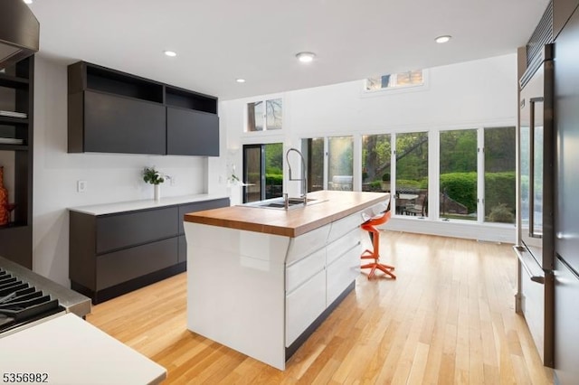 11 Kerby Ln, Mendham Boro, NJ 07945 - kitchen featuring modern cabinets, a sink, butcher block countertops, and recessed lighting
