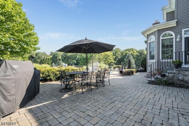 view of patio / terrace with a grill and outdoor dining space