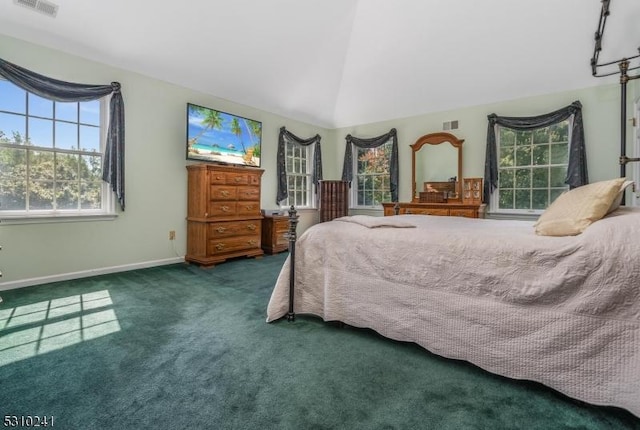 carpeted bedroom with vaulted ceiling and baseboards