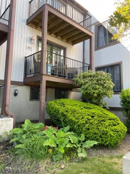 back of house with a balcony