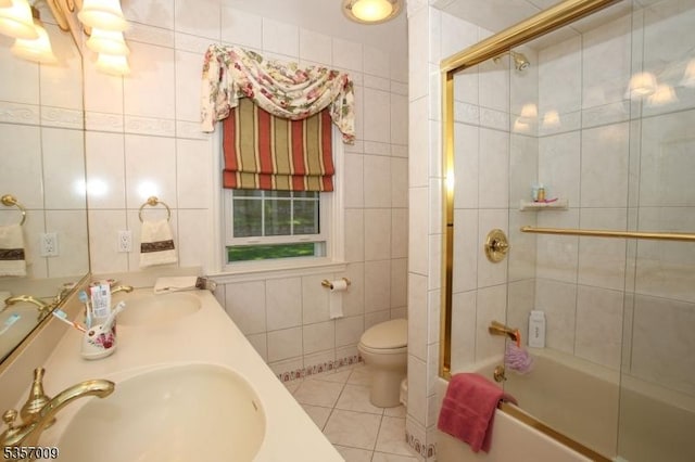 45 Linwood Ave, Dover Town, NJ 07801 - bathroom featuring tile walls, toilet, bath / shower combo with glass door, tile patterned flooring, and double vanity