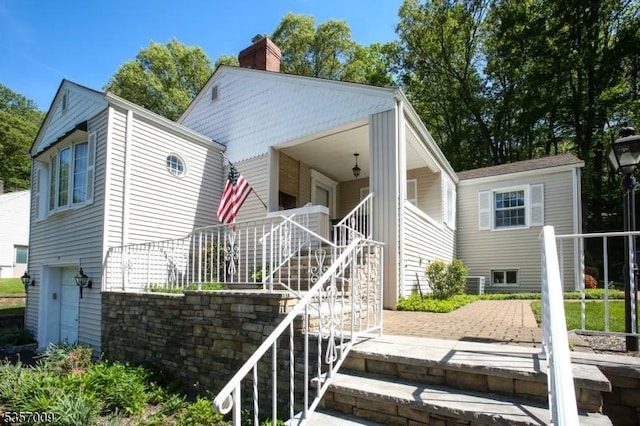 45 Linwood Ave, Dover Town, NJ 07801 - view of front of home with stairway and a chimney