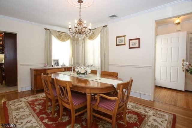 45 Linwood Ave, Dover Town, NJ 07801 - dining area featuring a chandelier, light wood-style floors, ornamental molding, and baseboards