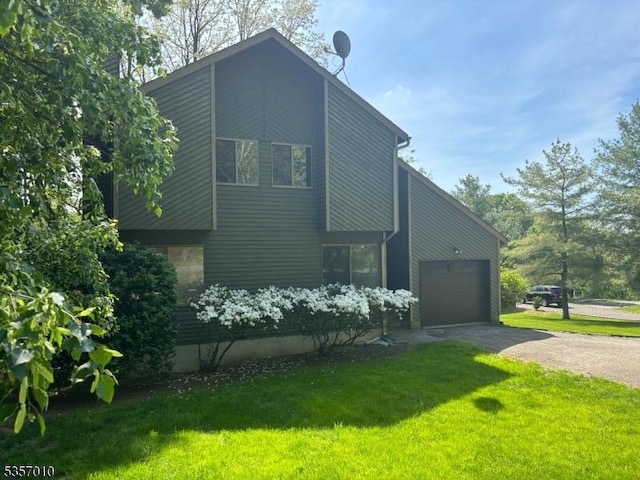 60 Dewey Ave, High Bridge Boro, NJ 08829 - view of home's exterior with dirt driveway, an attached garage, and a lawn