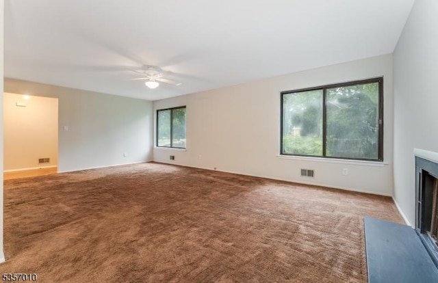 60 Dewey Ave, High Bridge Boro, NJ 08829 - spare room with ceiling fan, carpet flooring, a fireplace with flush hearth, and baseboards