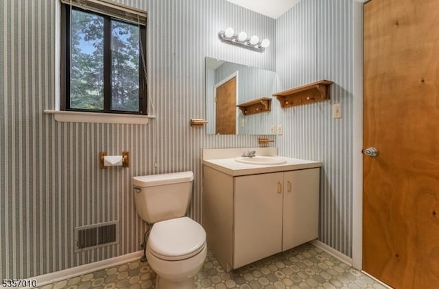 60 Dewey Ave, High Bridge Boro, NJ 08829 - half bathroom featuring vanity, toilet, healthy amount of natural light, and baseboards
