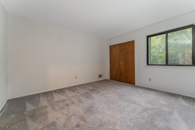 60 Dewey Ave, High Bridge Boro, NJ 08829 - unfurnished bedroom with carpet floors, a closet, and baseboards