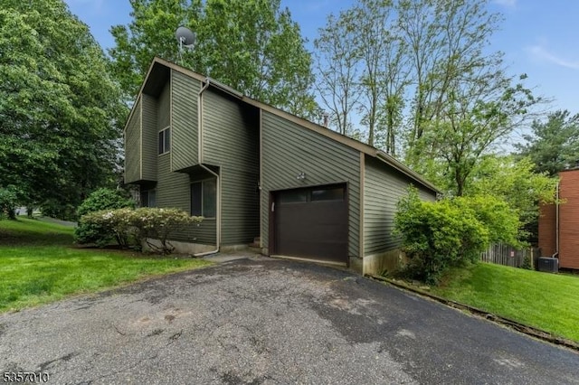 60 Dewey Ave, High Bridge Boro, NJ 08829 - view of front of home featuring driveway, a garage, a front lawn, and central AC
