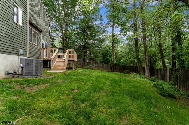 60 Dewey Ave, High Bridge Boro, NJ 08829 - view of yard with a deck, central air condition unit, stairs, and view of wooded area