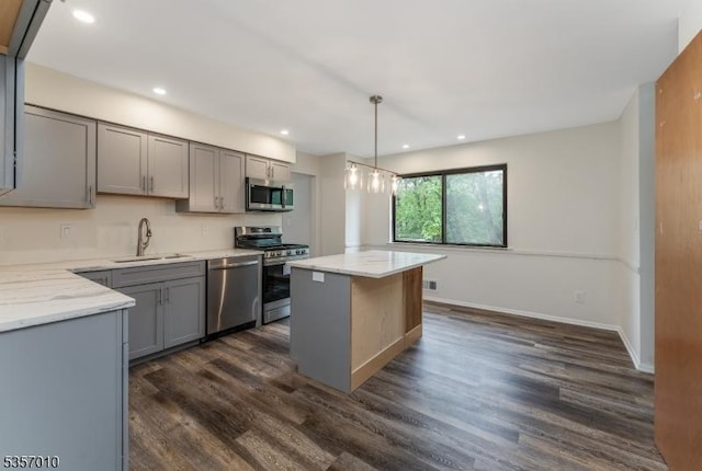 60 Dewey Ave, High Bridge Boro, NJ 08829 - kitchen with stainless steel appliances, gray cabinetry, a sink, dark wood-style floors, and a kitchen island