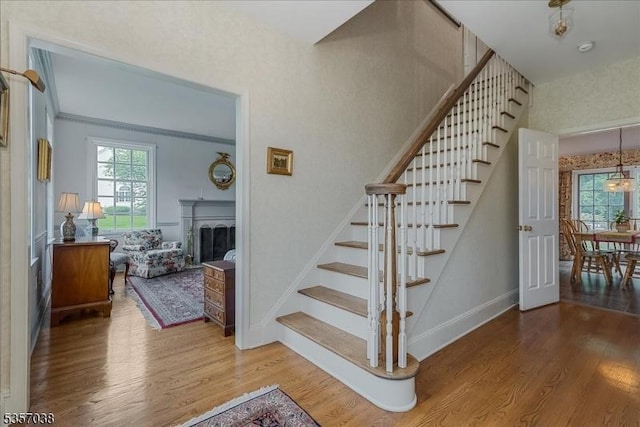 16 Dorset Ln, Andover Twp, NJ 07848 - staircase featuring wood finished floors, baseboards, and a fireplace