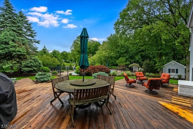 16 Dorset Ln, Andover Twp, NJ 07848 - wooden deck featuring outdoor dining space, an outdoor living space, view of scattered trees, and an outbuilding
