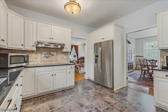 16 Dorset Ln, Andover Twp, NJ 07848 - kitchen with appliances with stainless steel finishes, under cabinet range hood, stone finish flooring, tasteful backsplash, and white cabinetry