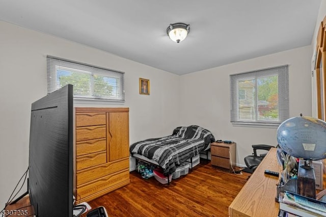 bedroom featuring wood finished floors