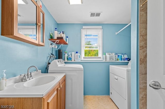 laundry room featuring washer and dryer and cabinet space