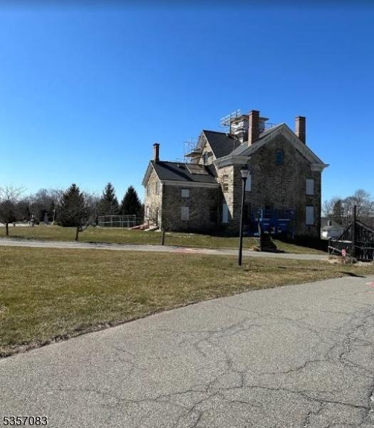 8 Tudor Pl Unit 8, Mount Olive Twp, NJ 07828 - view of home's exterior with a lawn