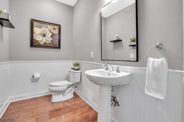 4 Frey Rd, Hillsborough Twp, NJ 08844 - half bath with wainscoting, wood finished floors, and toilet