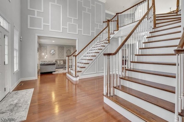 4 Frey Rd, Hillsborough Twp, NJ 08844 - foyer entrance with a high ceiling, stairs, wood finished floors, and baseboards
