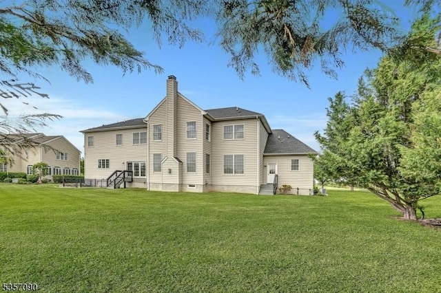 4 Frey Rd, Hillsborough Twp, NJ 08844 - rear view of house featuring a chimney and a lawn