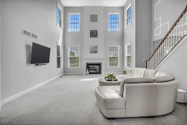 4 Frey Rd, Hillsborough Twp, NJ 08844 - carpeted living area featuring a high ceiling, baseboards, stairway, and a fireplace