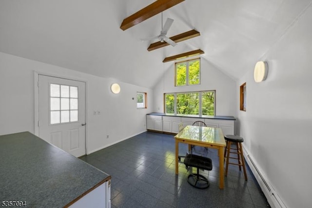 dining space with a baseboard radiator, beam ceiling, a ceiling fan, baseboards, and high vaulted ceiling