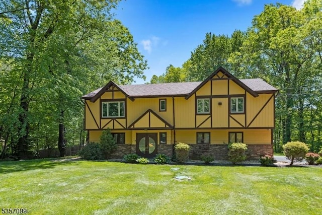 79 Lozier Rd, Mount Olive Twp, NJ 07828 - english style home featuring a front lawn, french doors, and stone siding