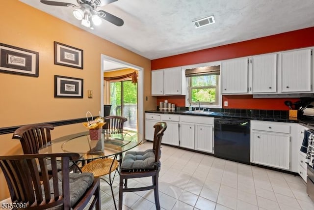 79 Lozier Rd, Mount Olive Twp, NJ 07828 - kitchen featuring black dishwasher, a sink, plenty of natural light, and white cabinetry