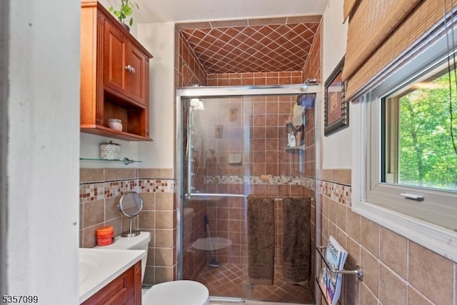 79 Lozier Rd, Mount Olive Twp, NJ 07828 - bathroom with tile walls, toilet, a shower stall, vanity, and a wainscoted wall