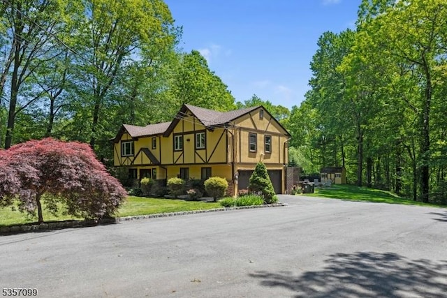 79 Lozier Rd, Mount Olive Twp, NJ 07828 - tudor-style house with a garage and driveway