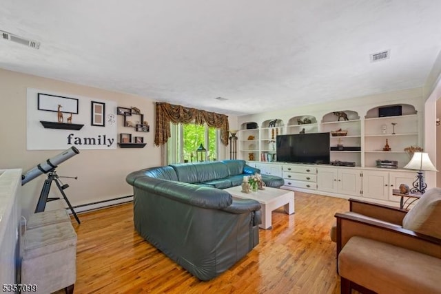 79 Lozier Rd, Mount Olive Twp, NJ 07828 - living area with light wood finished floors and baseboard heating