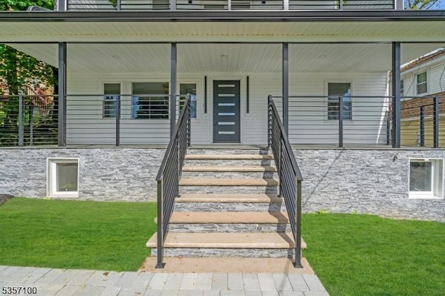 162 Lakeside Blvd, Hopatcong Boro, NJ 07843 - doorway to property featuring stone siding, a yard, and covered porch