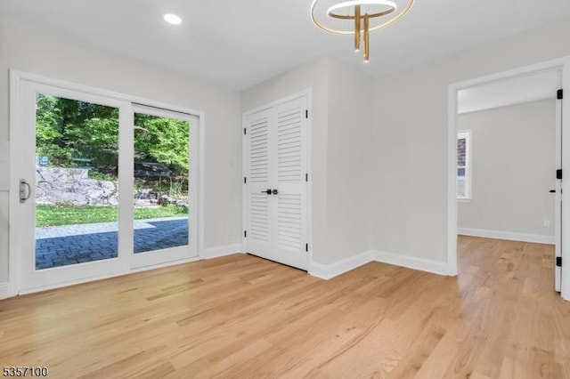 162 Lakeside Blvd, Hopatcong Boro, NJ 07843 - unfurnished dining area with light wood-type flooring, baseboards, recessed lighting, and a chandelier