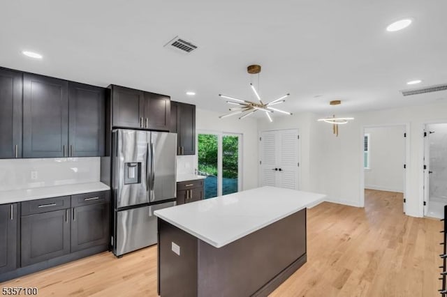 162 Lakeside Blvd, Hopatcong Boro, NJ 07843 - kitchen with stainless steel fridge with ice dispenser, light countertops, recessed lighting, light wood-style floors, and a kitchen island