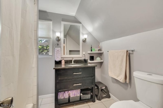 bathroom with toilet, lofted ceiling, vanity, tile patterned flooring, and a shower with curtain