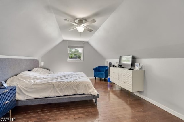 bedroom with hardwood / wood-style flooring, baseboards, vaulted ceiling, and a ceiling fan