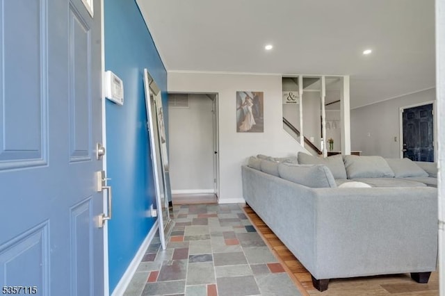 living area with crown molding, baseboards, recessed lighting, and stairs